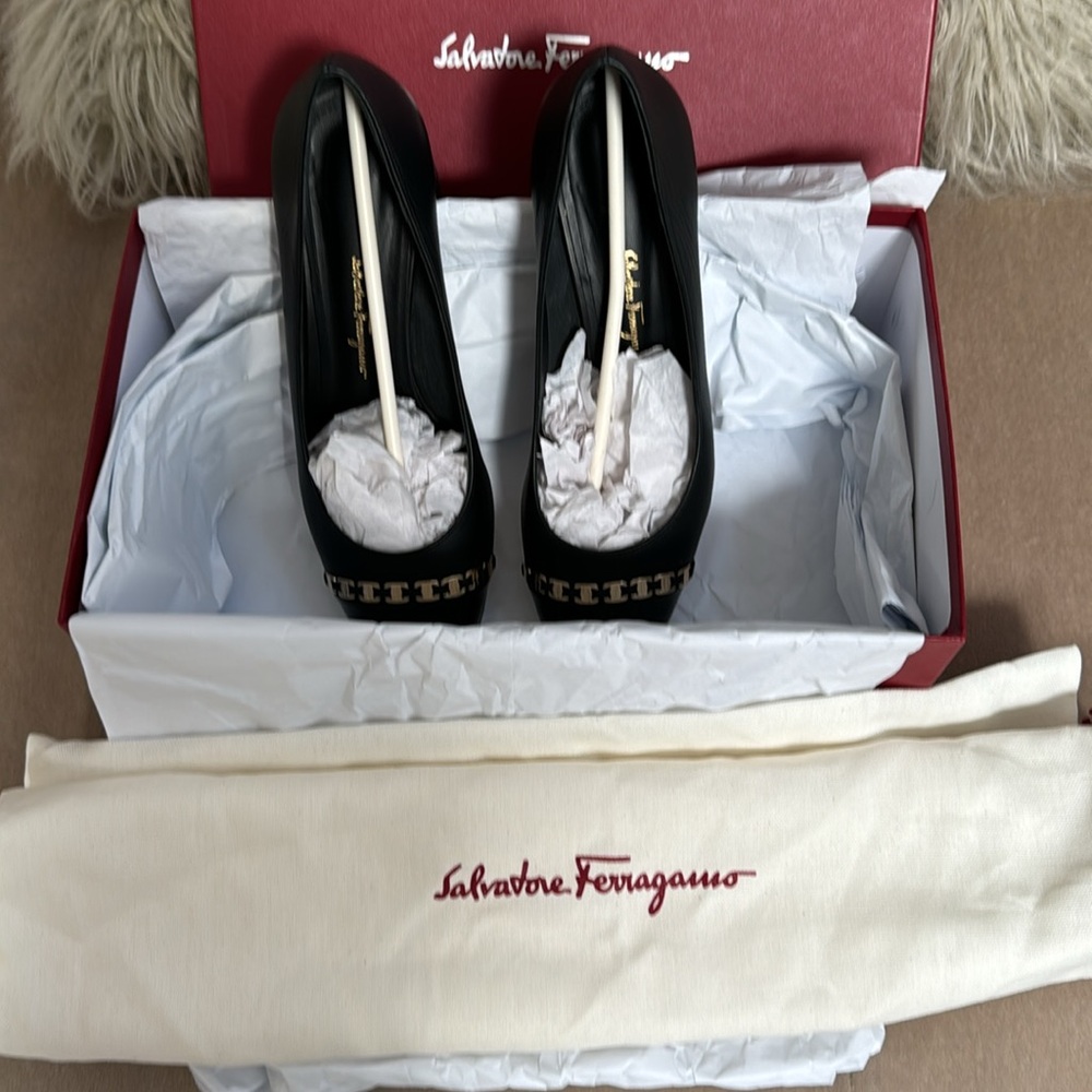 Salvatore Ferragamo black leather pumps with patent cap toe, gold Monogram chain